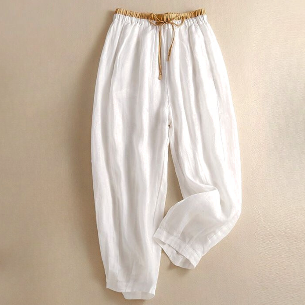 Beige tapered linen trousers for women, loose pull-on pants with a relaxed fit and comfortable design.