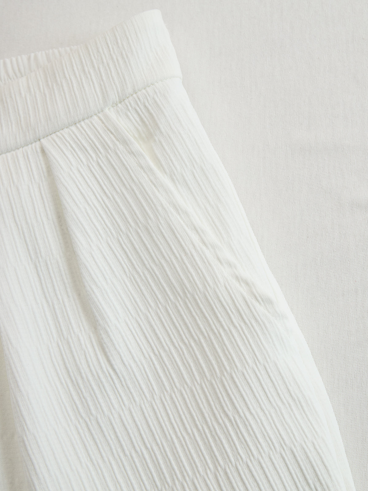 Cream textured lantern sleeve two-piece set with pants for women, stylish and comfortable fashion outfit.