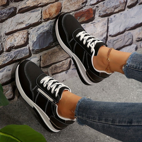 Breathable women's orthopedic sneakers with non-slip soles, designed for comfort and support, featuring white and gray mesh fabric.