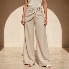 Beige asymmetric waist wide-leg women's pants with relaxed fit and flowy fabric, stylish and comfortable for casual wear.