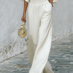 Cream textured lantern sleeve two-piece set for women, featuring stylish pants and a matching top with lantern sleeves.