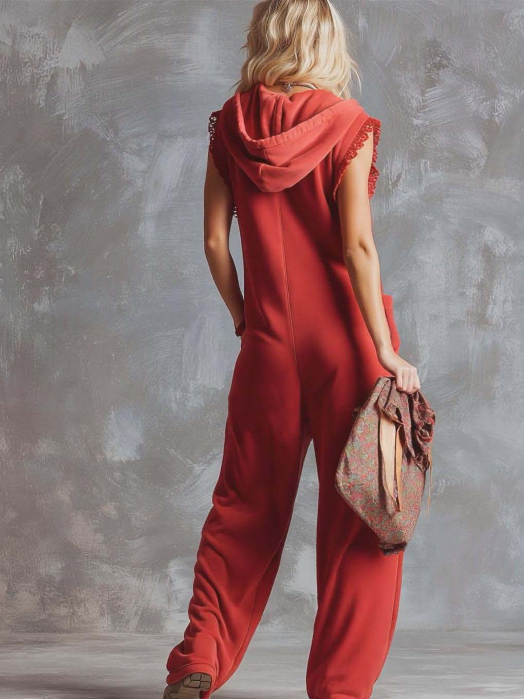 Raspberry red cotton women’s hooded zip-front jumpsuit with pants style, featuring a front zipper and casual fit.