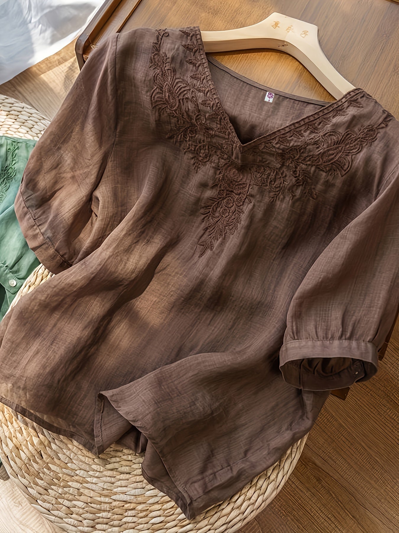 Light blue V-neck linen summer blouse for women, flowy and casual, stylish top perfect for warm weather.