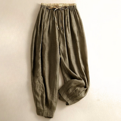 Beige tapered linen trousers for women, loose pull-on style with relaxed fit, ideal for casual or everyday wear.