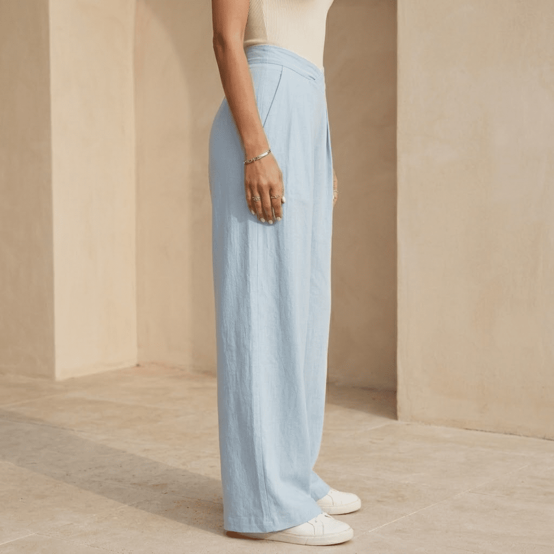 Women’s criss-cross waist wide-leg trousers by Tammy Bradley, featuring a relaxed fit and stylish design, shown on a model.