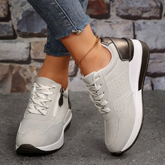 Breathable women's orthopedic sneakers with non-slip soles, designed for comfort and support, featuring a sleek casual style.
