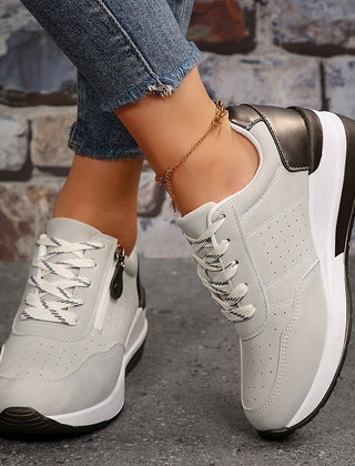 Breathable women's orthopedic sneakers with non-slip soles, designed for comfort and support, featuring a sleek casual style.