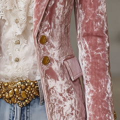Pink velvet blazer with gold buttons for women, stylish jacket featuring a tailored fit and elegant design.