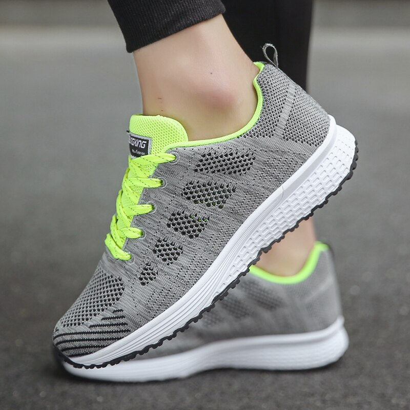 Comfortable women's orthopedic walking shoes with lace-up knit design, featuring supportive soles for all-day comfort.