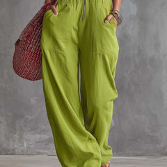 Bright green cotton linen women's jumpsuit with zip-front, featuring a stylish and comfortable design.