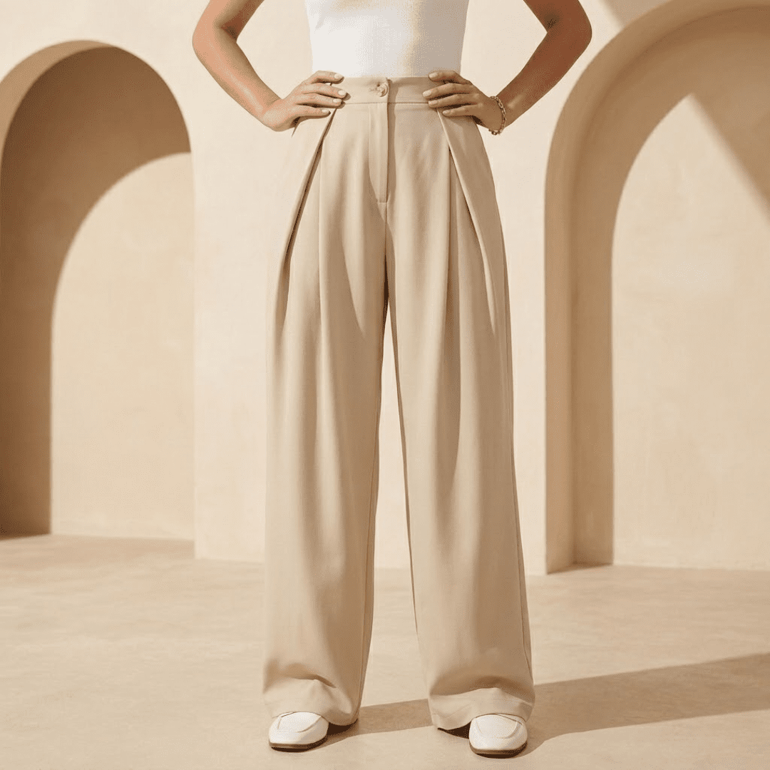 Women's high-waisted wide-leg tailored trousers by Tammy Bradley, featuring a sleek fit and classic design in neutral fabric.