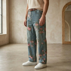 Unisex floral rose print wide-leg denim jeans for men, featuring colorful rose patterns and a relaxed fit.