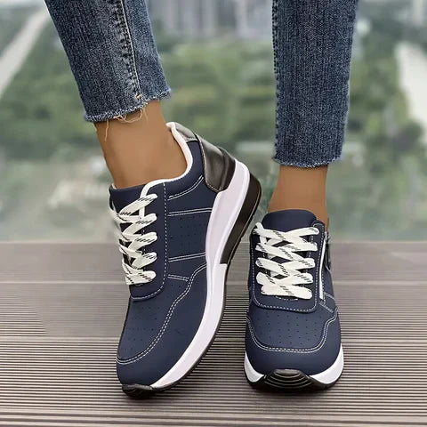 Breathable women's orthopedic sneakers with non-slip soles, designed for comfort and support, in a stylish casual look.