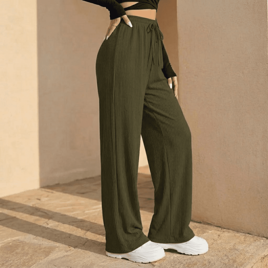 Women's plissé wide-leg trousers by Tammy Bradley, featuring flowy fabric and relaxed fit, shown in a stylish full-length view.