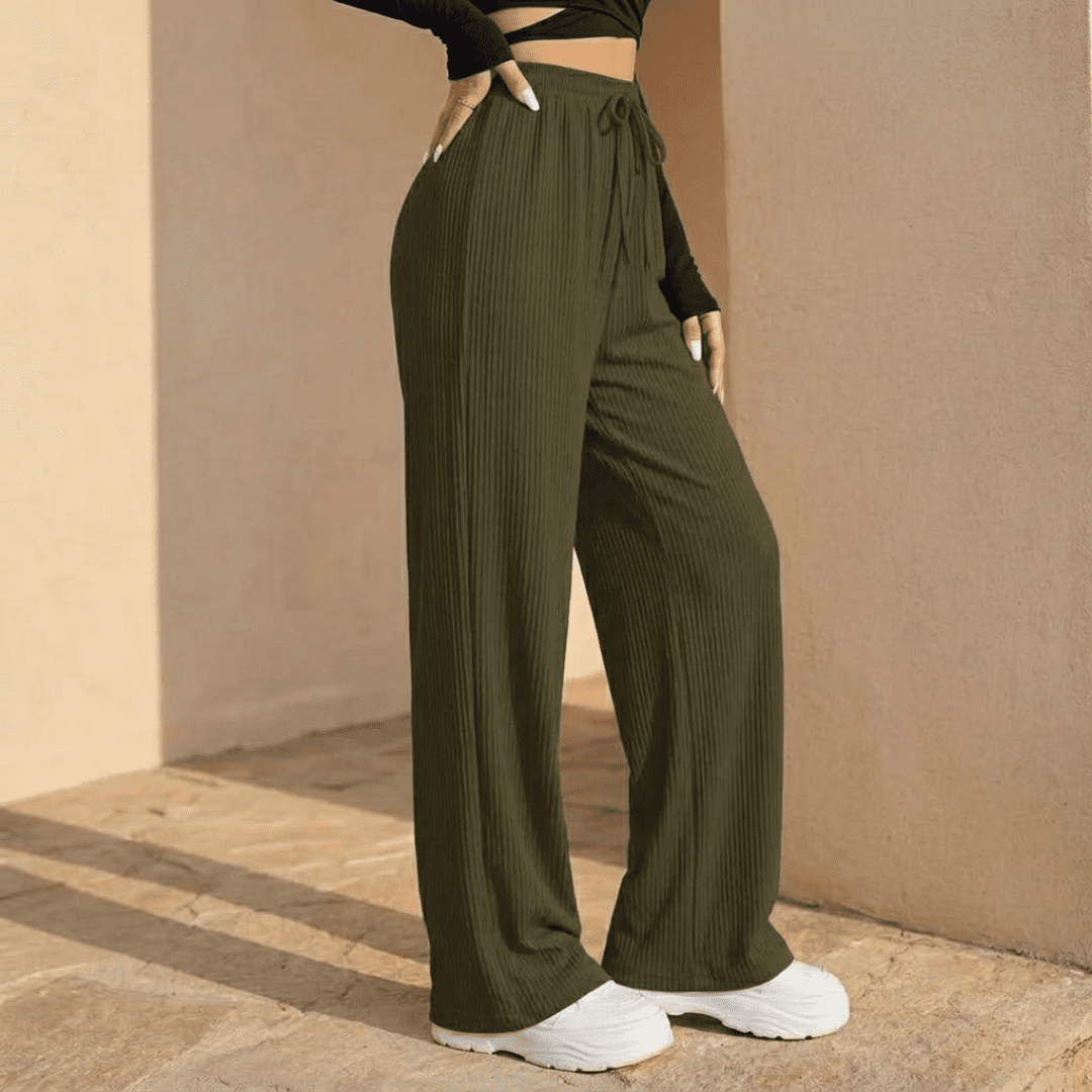 Women's plissé wide-leg trousers by Tammy Bradley, featuring flowy fabric and relaxed fit, shown in a stylish full-length view.