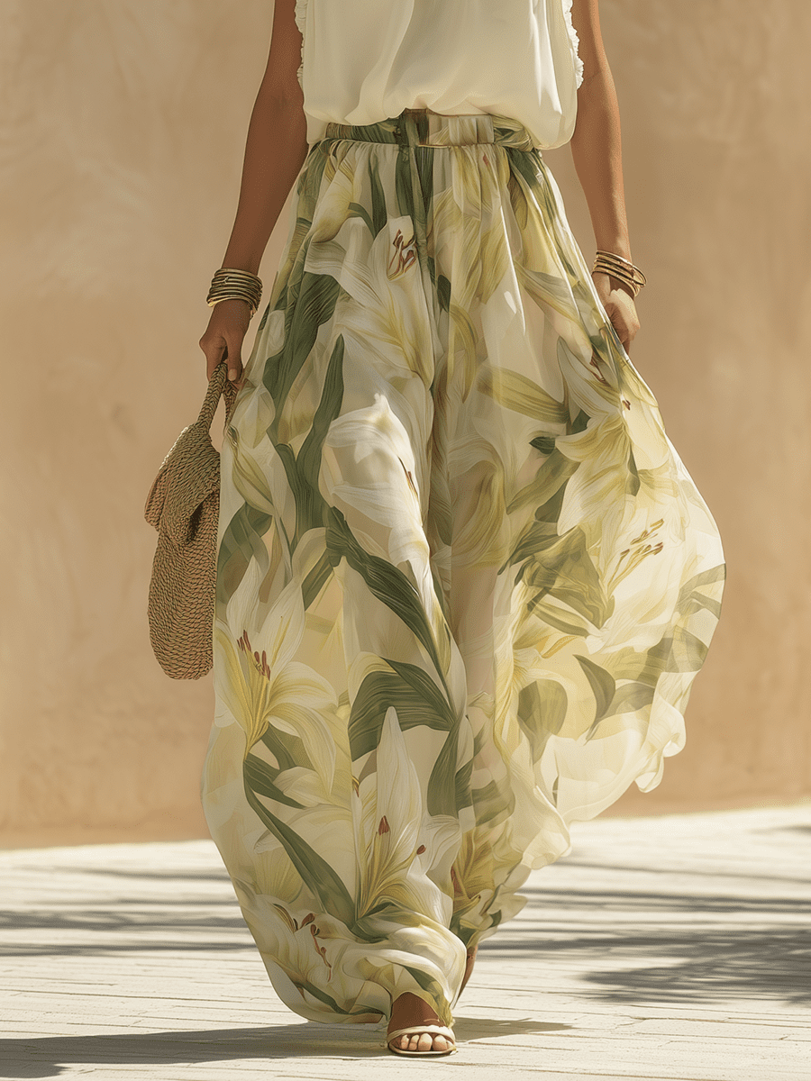 White flowing maxi dress for women by Tammy Bradley, lightweight fabric with elegant, breezy design perfect for summer wear.