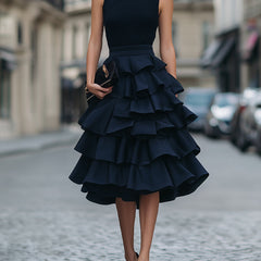 Sleeveless high neck tiered ruffle midi dress in soft fabric, featuring layered ruffles and a flowy silhouette.