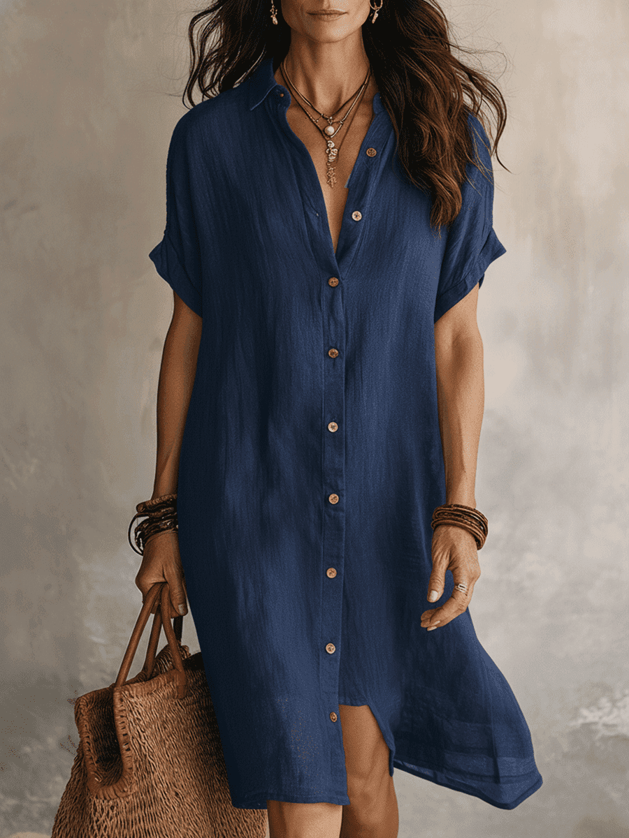 Black linen relaxed midi dress for women by Tammy Bradley, showcasing a flowy, casual style with short sleeves and a midi length.