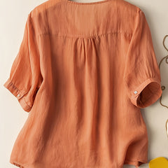 Light beige women's summer blouse with V-neck and flowy linen fabric, casual and stylish for warm weather.