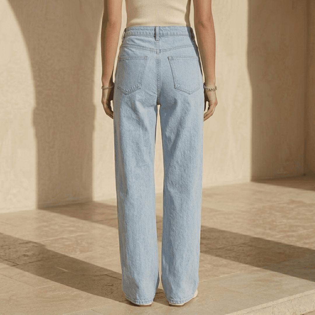 Women's high-waisted wide-leg denim jeans by Tammy Bradley, front view showing classic blue color and relaxed fit.