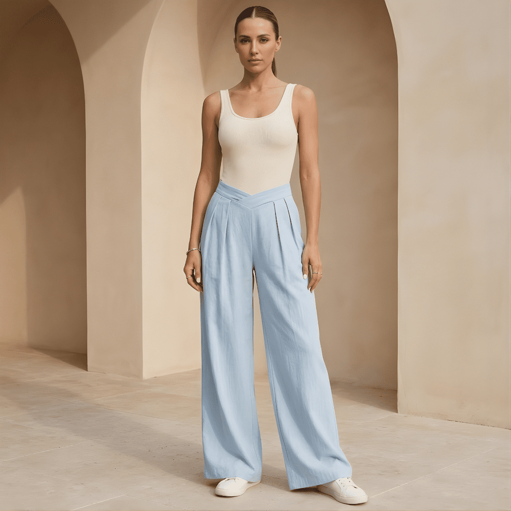 Women's criss-cross waist wide-leg trousers by Tammy Bradley, shown in a stylish fit with flowing fabric and wide-leg silhouette.