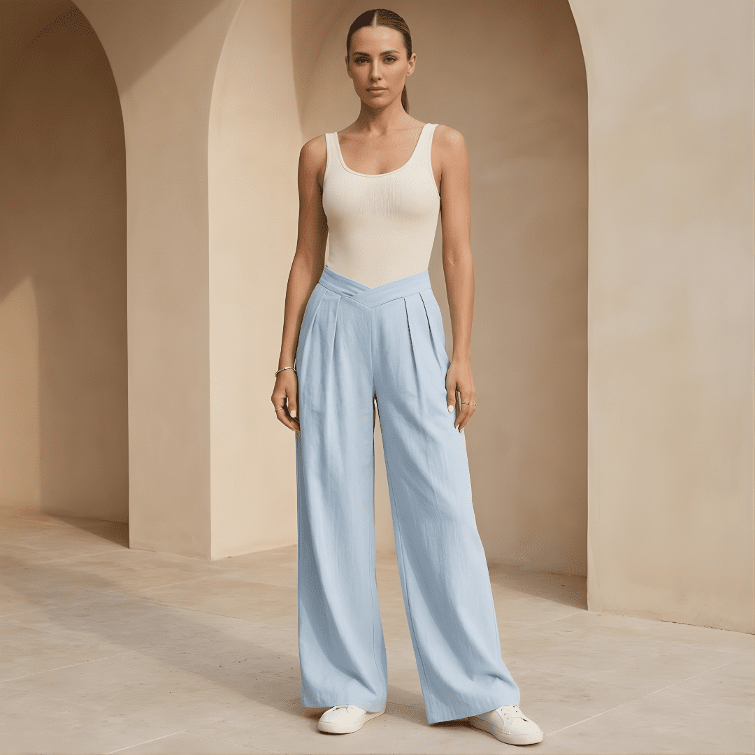 Women's criss-cross waist wide-leg trousers by Tammy Bradley, shown in a stylish fit with flowing fabric and wide-leg silhouette.