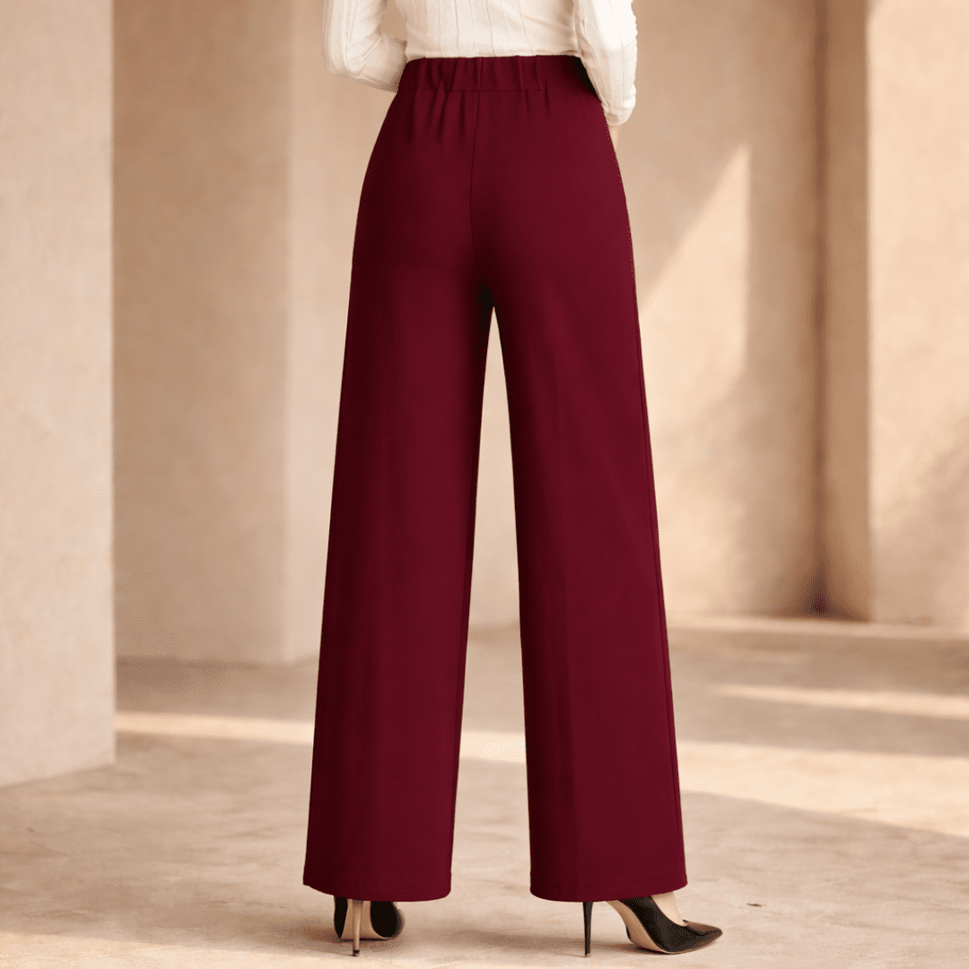 Women's high-waist wide-leg pants by Tammy Bradley, tailored fit, in a neutral fabric, shown on a model.