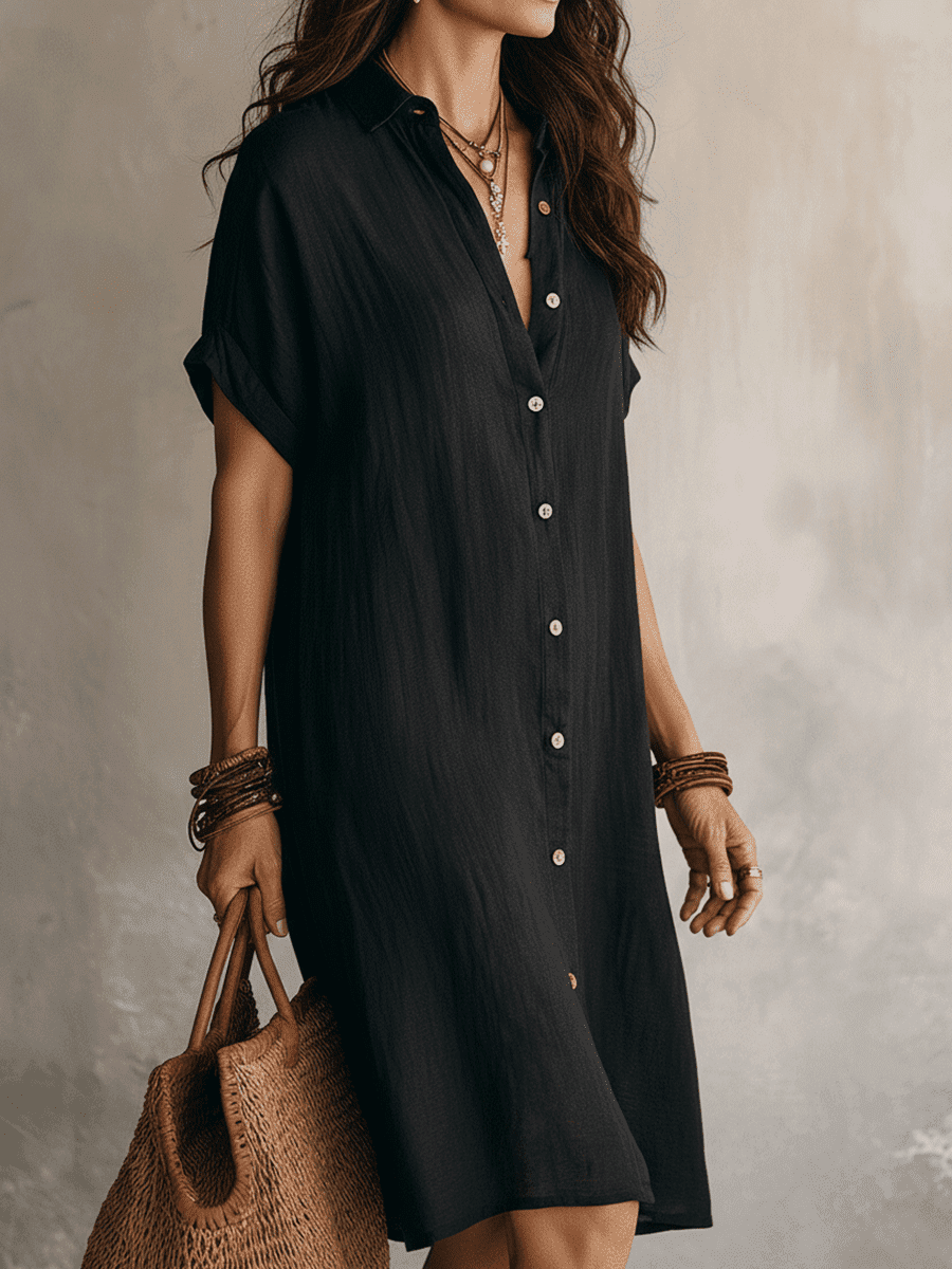 Black linen relaxed midi dress for women by Tammy Bradley, featuring a loose fit and elegant midi length.