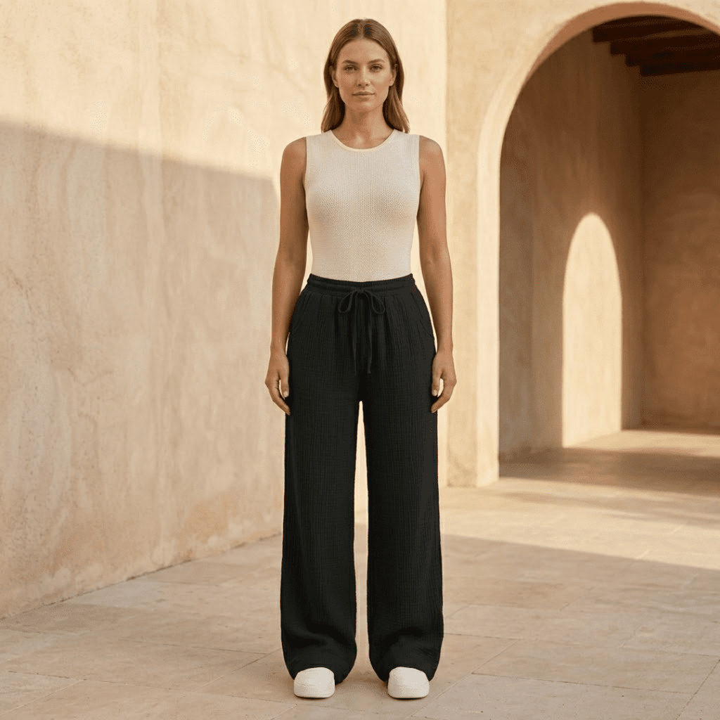 Women's cotton wide-leg trousers by Tammy Bradley, featuring a relaxed fit and comfortable, flowing wide-leg design.