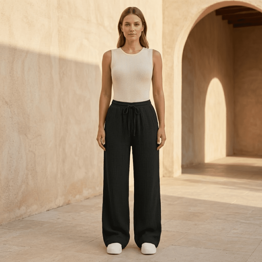 Women's cotton wide-leg trousers by Tammy Bradley, featuring a relaxed fit and comfortable, flowing wide-leg design.