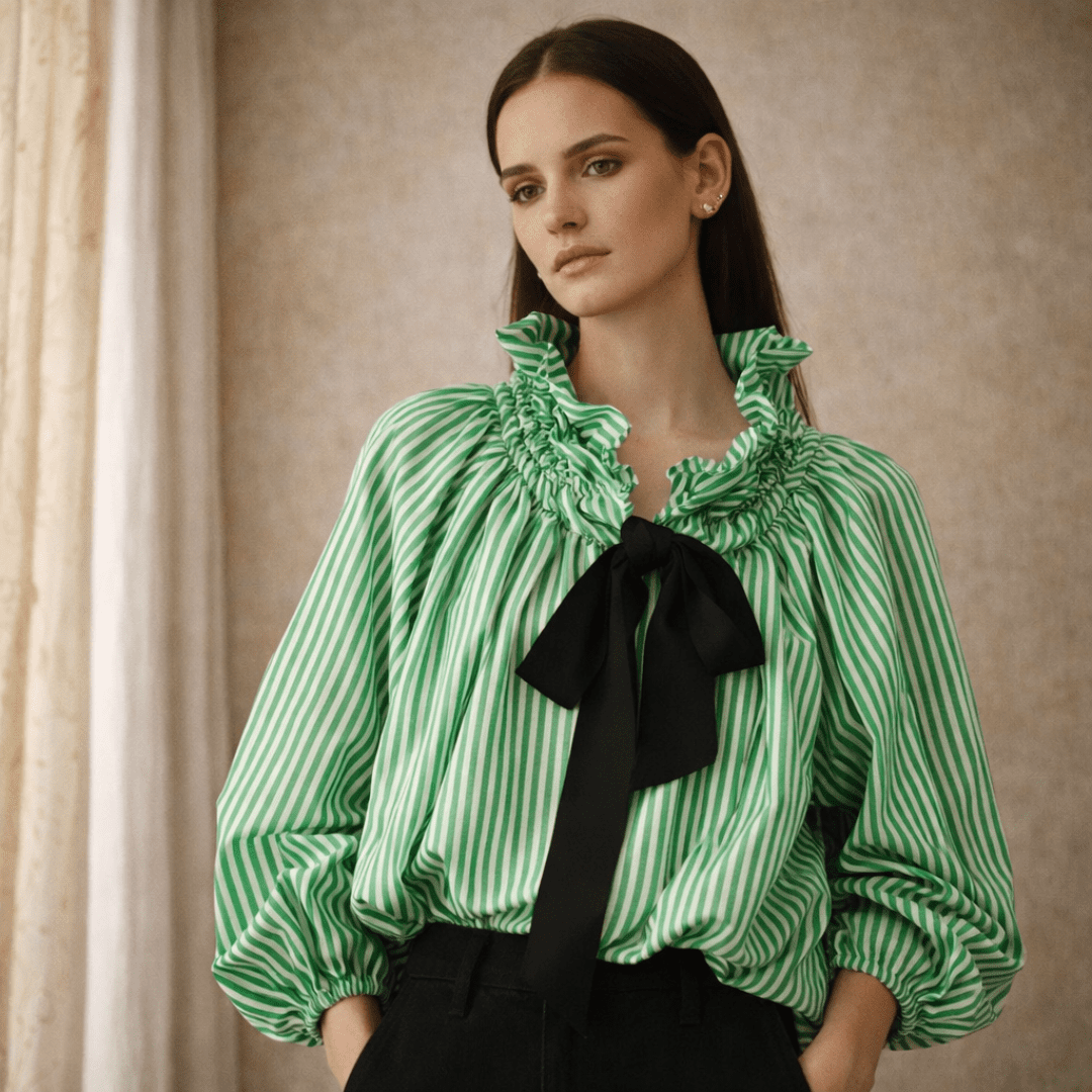 Gingham ruffle oversized long-sleeve blouse for women by Tammy Bradley, featuring a stylish checkered pattern and ruffled cuffs.