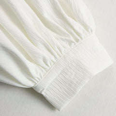 Cream textured lantern sleeve two-piece pants set for women, featuring stylish lantern sleeves and comfortable fit.