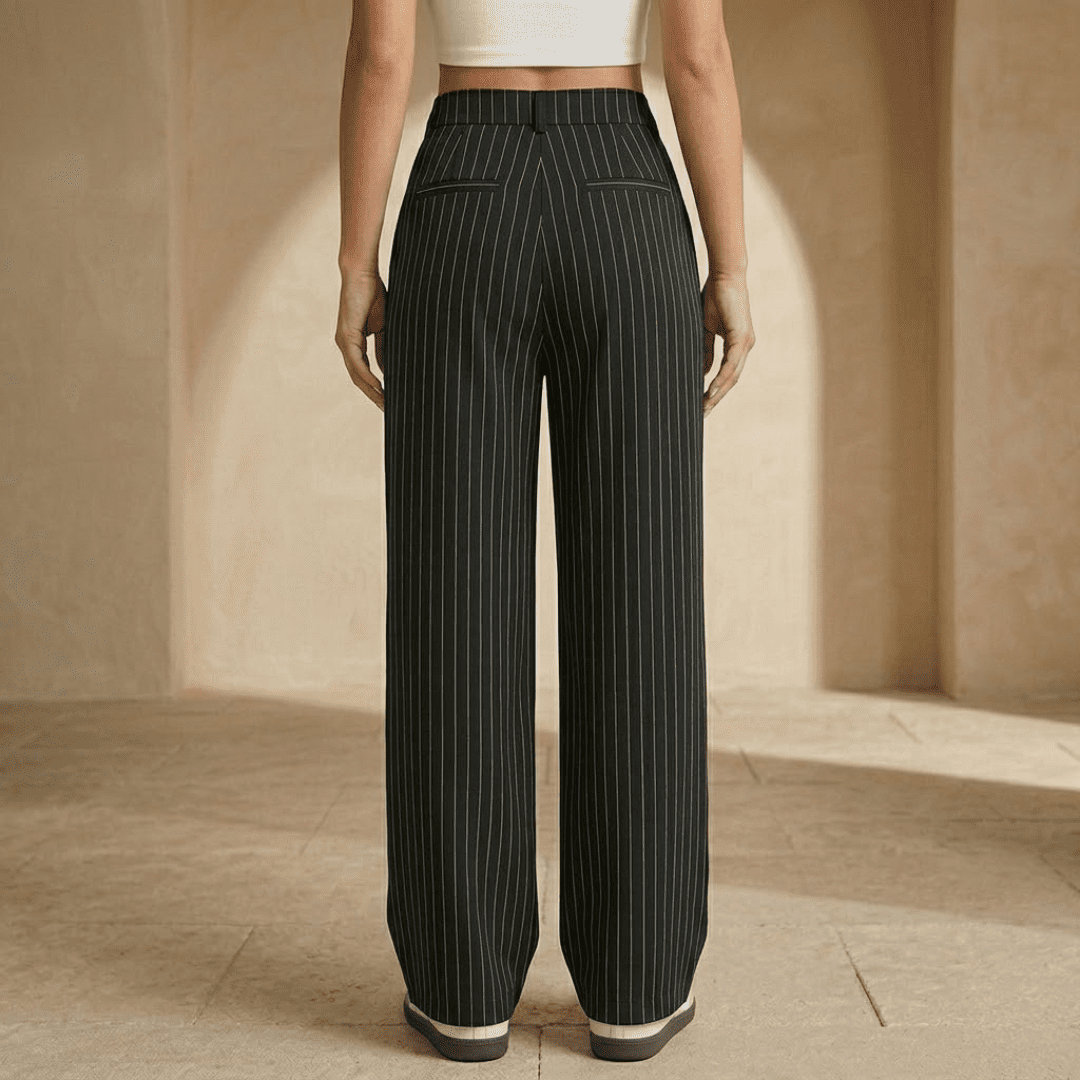 Tammy Bradley women's pinstripe high-waisted wide-leg trousers on a model, showing the tailored fit and classic pattern.