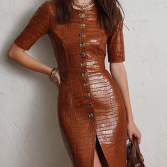 Caramel croc-embossed faux leather midi dress with fitted silhouette and sleeveless design, stylish for casual or evening wear.