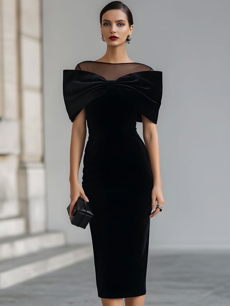 Black velvet bow midi dress for women by Tammy Bradley, featuring a stylish elegant design with a bow detail at the waist.