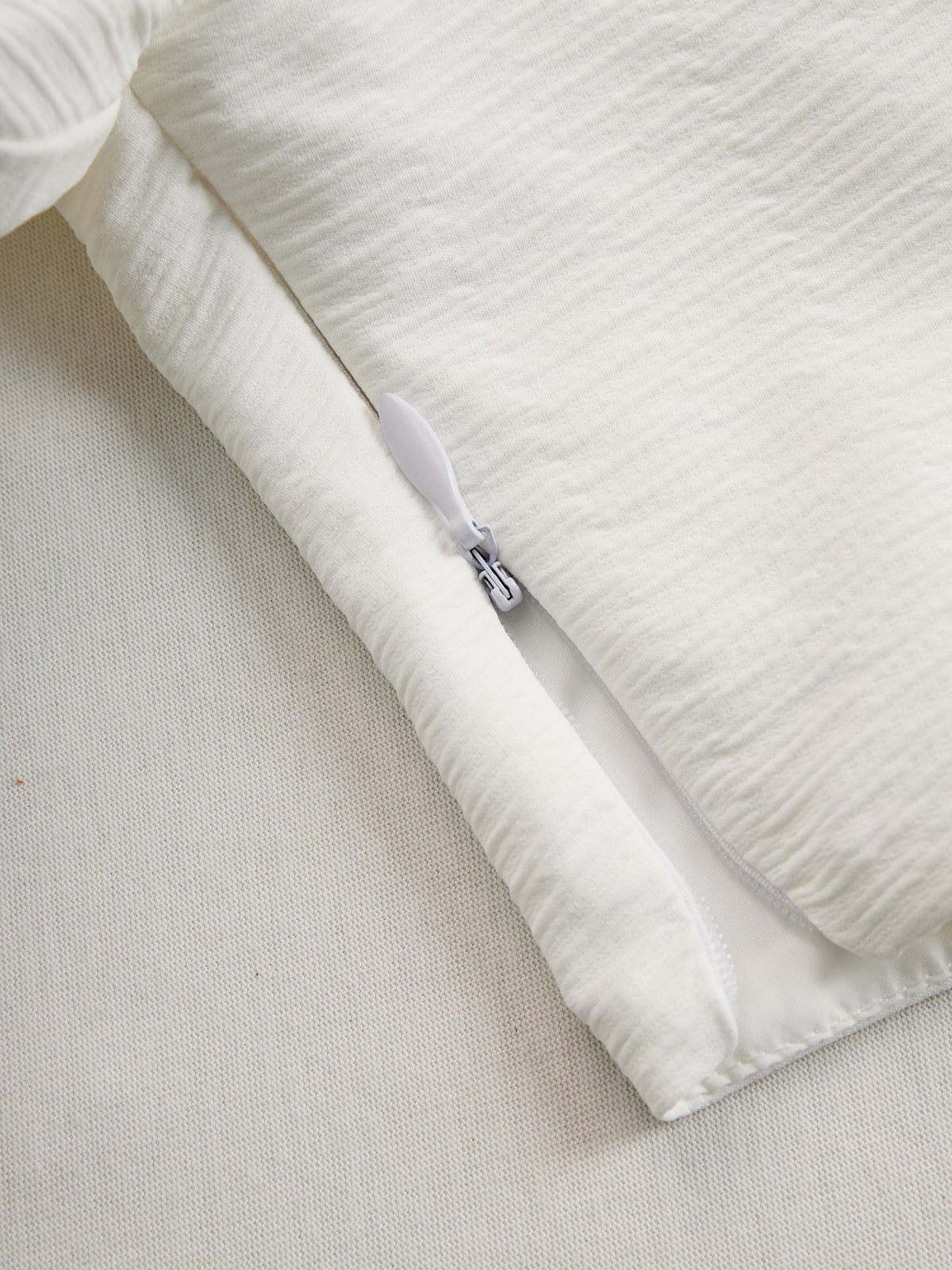 Cream textured lantern sleeve two-piece pants set for women featuring stylish lantern sleeves and a comfortable fit.