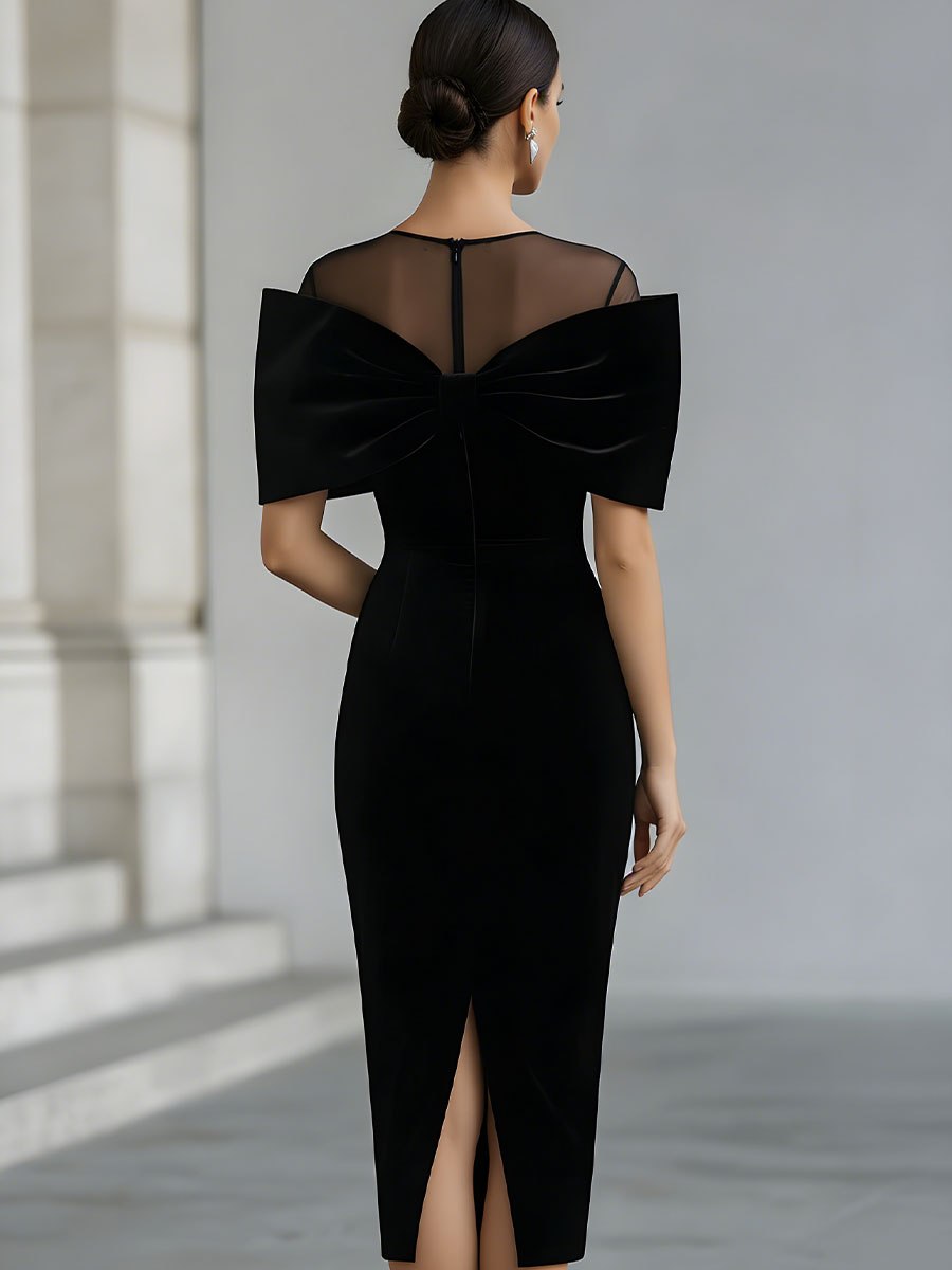 Black velvet bow midi dress for women by Tammy Bradley, featuring a fitted silhouette and elegant bow detail at the waist.