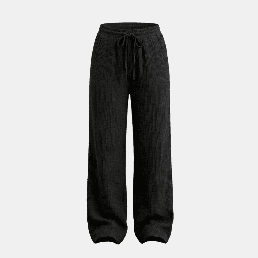 Women’s cotton wide-leg trousers by Tammy Bradley, showing relaxed fit and lightweight fabric in a neutral color.