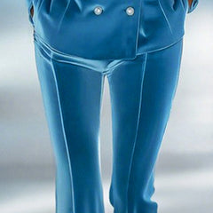 Blue loose velvet flared women's trousers with a relaxed fit and stylish flare, perfect for casual or dressy occasions.
