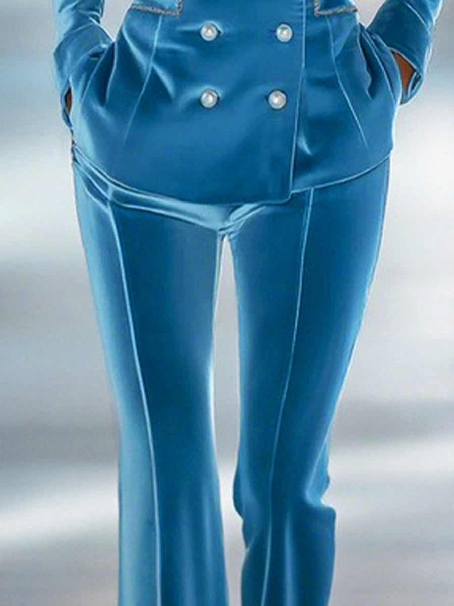 Blue loose velvet flared women's trousers with a relaxed fit and stylish flare, perfect for casual or dressy occasions.