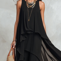 Black bohemian layered chiffon maxi dress with flowing fabric and tiered design, perfect for casual or boho-inspired looks.