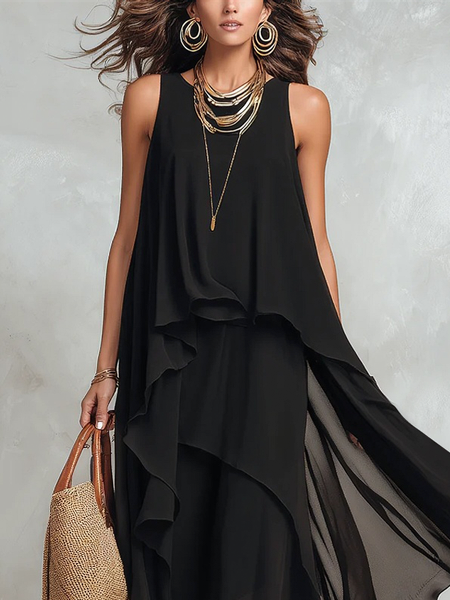 Black bohemian layered chiffon maxi dress with flowing fabric and tiered design, perfect for casual or boho-inspired looks.