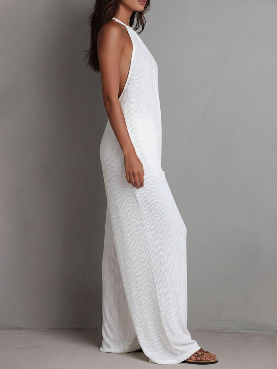 White pleated halter neck wide-leg resort jumpsuit for women, featuring stylish pants from My Store.