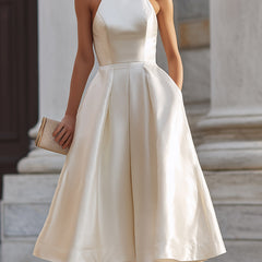 Halter-neck pleated midi dress for women featuring flowing fabric and elegant design, perfect for stylish occasions.