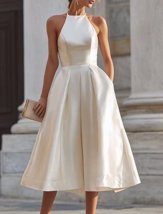 Halter-neck pleated midi dress for women featuring flowing fabric and elegant design, perfect for stylish occasions.