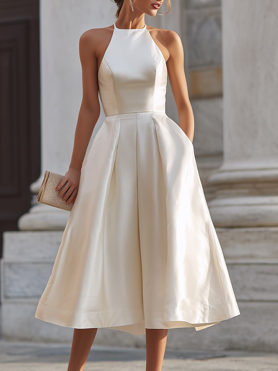 Halter-neck pleated midi dress for women featuring flowing fabric and elegant design, perfect for stylish occasions.