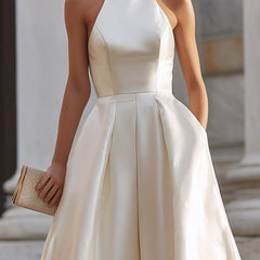 Halter-neck pleated midi dress for women featuring a flowy design and elegant style, perfect for stylish occasions.