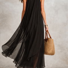 Black bohemian layered chiffon maxi dress with flowing fabric and tiered design, perfect for casual or boho-inspired occasions.