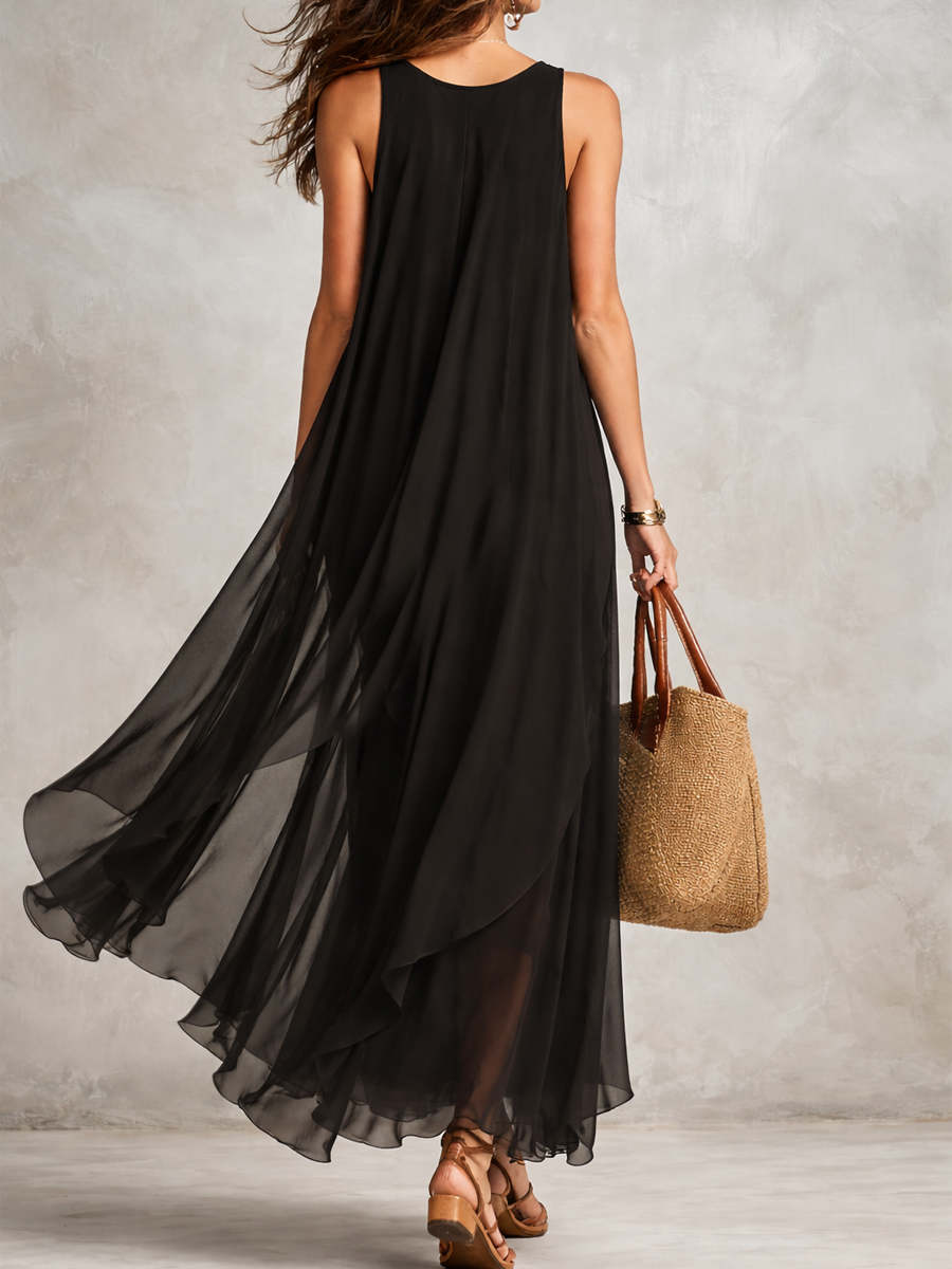 Black bohemian layered chiffon maxi dress with flowing fabric and tiered design, perfect for casual or boho-inspired occasions.