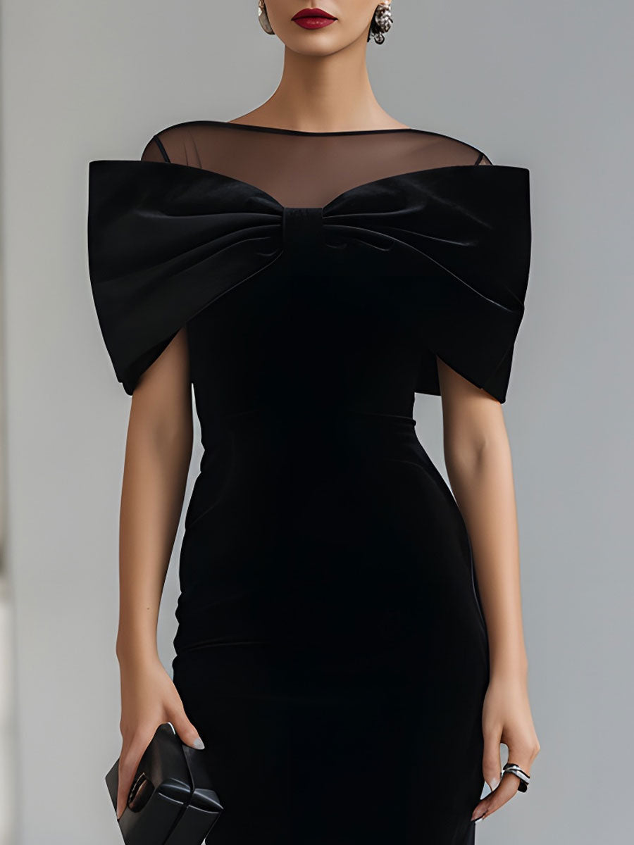 Black velvet bow midi dress for women by Tammy Bradley, featuring a fitted silhouette and elegant bow detail at the waist.